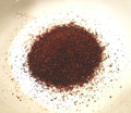 Actual ancho chile powder, accurately representing Spice Czar Ancho Chile Powder. Wikimedia Commons image.