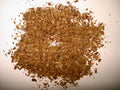 Dried basil leaves, accurately representing Spice Czar Dried Basil. Wikimedia Commons public-domain image by Miansari66.
