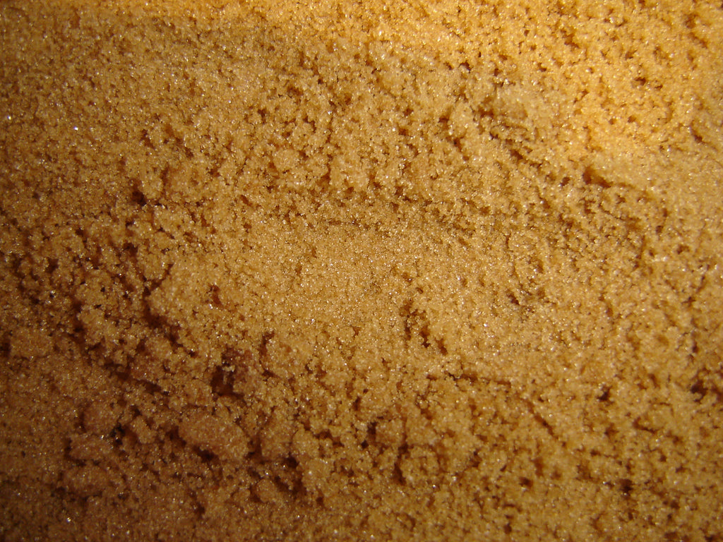 Close-up of actual brown sugar granules, accurately representing Spice Czar Brown Sugar. Wikimedia Commons image.