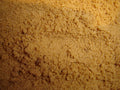 Close-up of actual brown sugar granules, accurately representing Spice Czar Brown Sugar. Wikimedia Commons image.