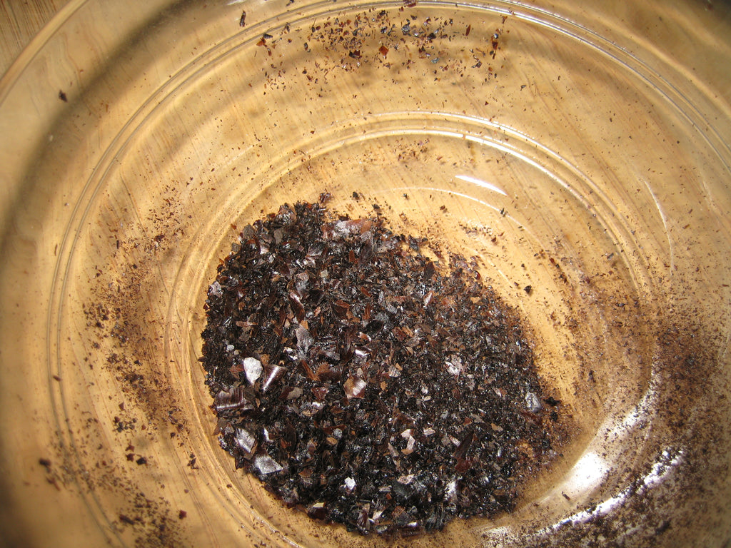 Actual ground dried Persian black limes, accurately representing Spice Czar Ground Black Lime. Photo by Roban Kramer via Wikimedia Commons, CC BY-SA 2.0.