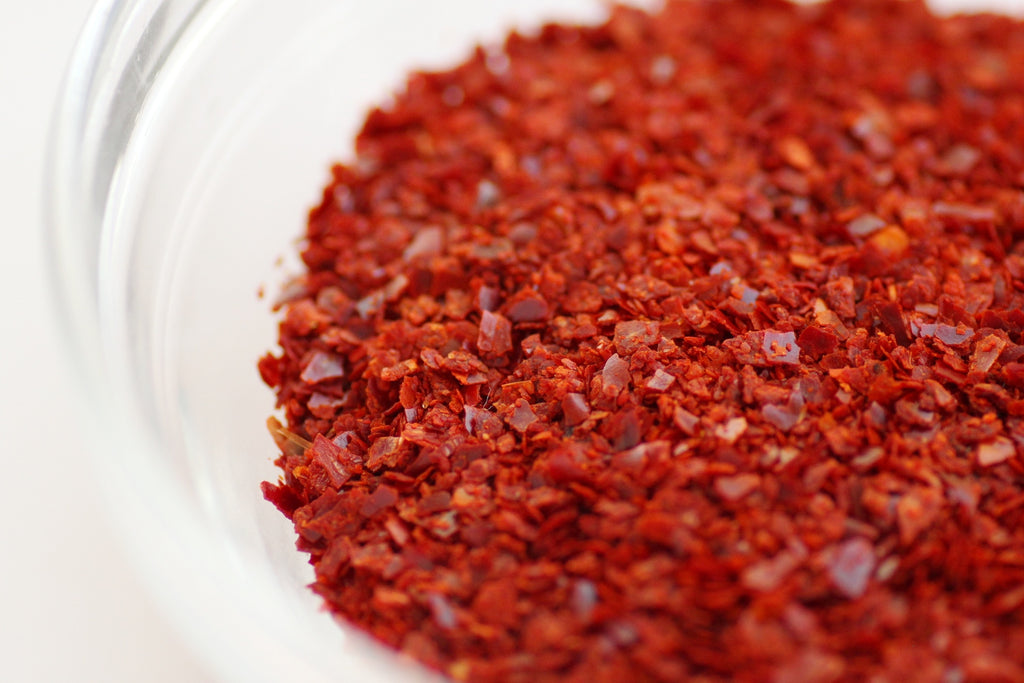 Actual Korean gochugaru chile powder and flakes, accurately representing Spice Czar Gochugaru Chile Flakes. Photo by Stacy Spensley via Wikimedia Commons.