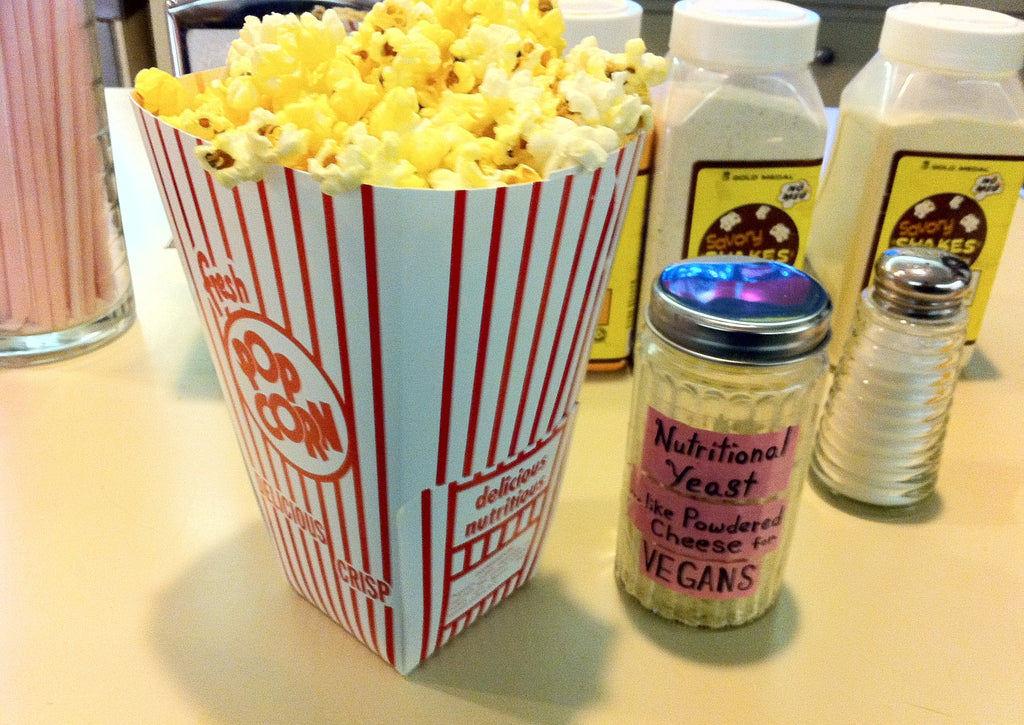 Popcorn topped with nutritional yeast, a direct popular use for Spice Czar Nutritional Yeast. Photo by Jeff Gunn via Wikimedia Commons, CC BY 2.0.