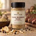 Spice Czar Garlic Mushroom Onion All-Purpose Seasoning in a 2 oz round glass shaker, with dried garlic, onion and black peppercorns and a sliced seared steak