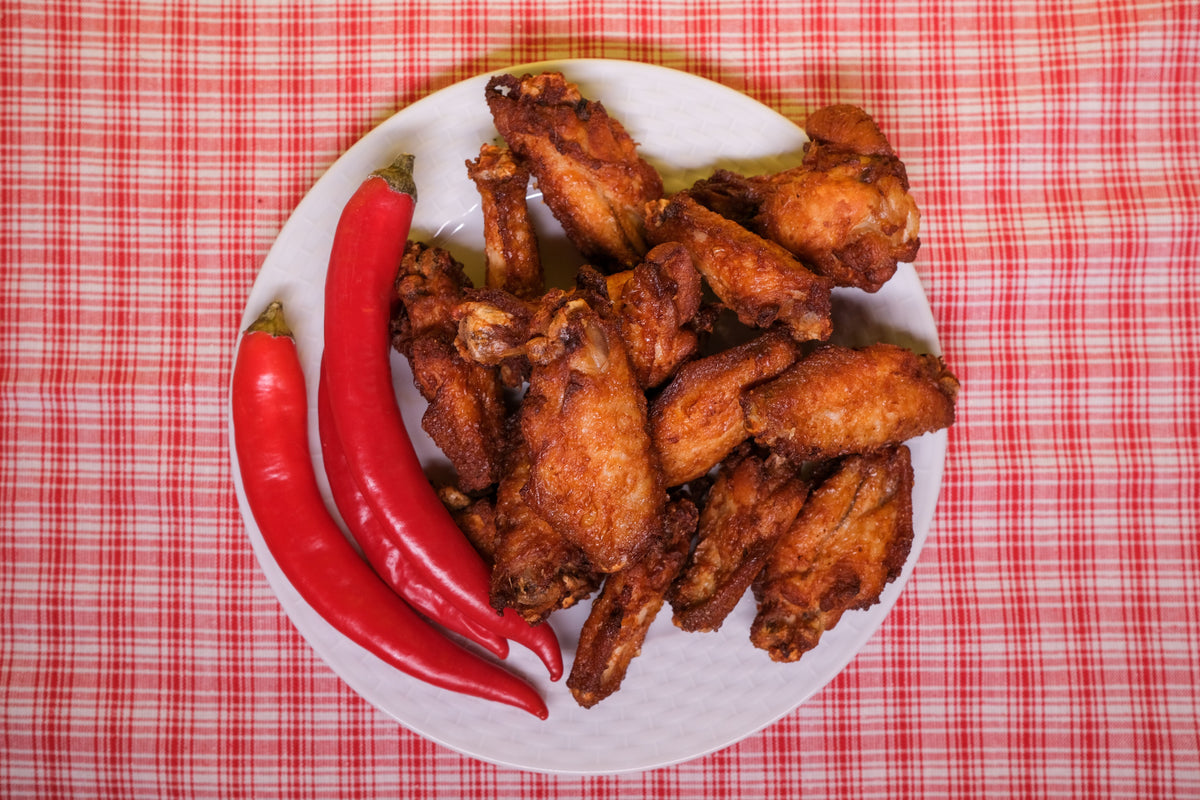 Spicy chicken wings with red chiles for Habanero Garlic Pepper seasoning