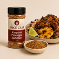 Kingston Pineapple Jerk Rub in labeled 4 oz shaker with loose rub, jerk chicken, pineapple, and rice and peas