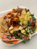 Tacos al pastor with pineapple shown as a serving use for Spice Czar Al Pastor Taco Seasoning. Photo by Koffermejia via Wikimedia Commons, CC BY-SA 4.0.