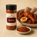 Spice Czar Berbere 4 oz shaker with vivid red spice and doro wat-style chicken stew