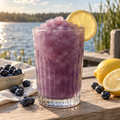 Serving suggestion: Blueberry Lemonade slushy with matching fresh fruit in a lakeside setting.