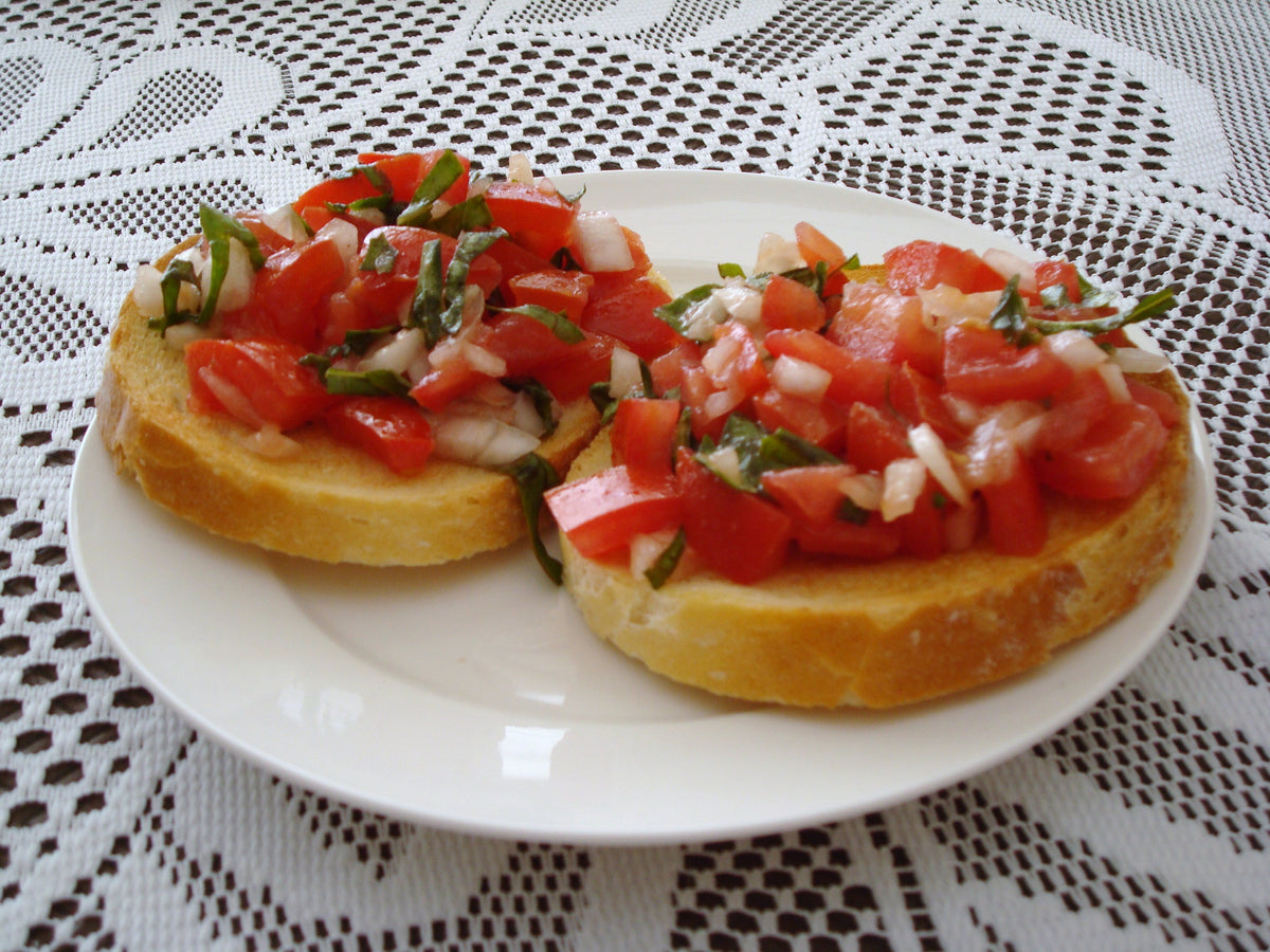 Tomato bruschetta shown as a serving use for Spice Czar Bruschetta Seasoning. Photo by Michael Spencer via Wikimedia Commons, CC BY 2.0.