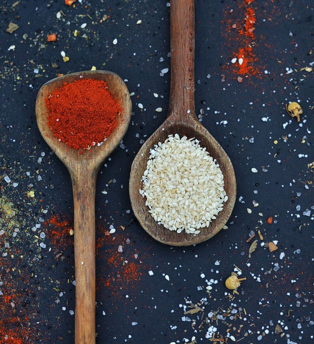Paprika and sesame seeds representing the smoky chile and sesame profile of Spice Czar Campfire Sausage Seasoning. Photo by Djordje Vezilic via Pexels, free to use under the Pexels license.