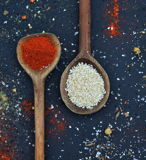 Paprika and sesame seeds representing the smoky chile and sesame profile of Spice Czar Campfire Sausage Seasoning. Photo by Djordje Vezilic via Pexels, free to use under the Pexels license.