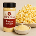 Butter Powder 4 oz Spice Czar shaker beside a bowl of buttered popcorn and a dish of pale yellow butter powder