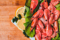 Serving suggestion for Chesapeake Bay Seasoning: whole cooked shrimp with lemon and herbs. Photo by Erik Mclean/Pexels; not a photograph of the dry blend.