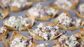 Serving suggestion for Chicken Salad Seasoning: creamy chopped chicken salad in crisp wonton cups. Photograph by Burst, CC0 via Pexels; not a photograph of the dry blend.