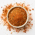 Chili Lime Seasoning in a bowl with visible chile, citrus and coarse seasoning texture