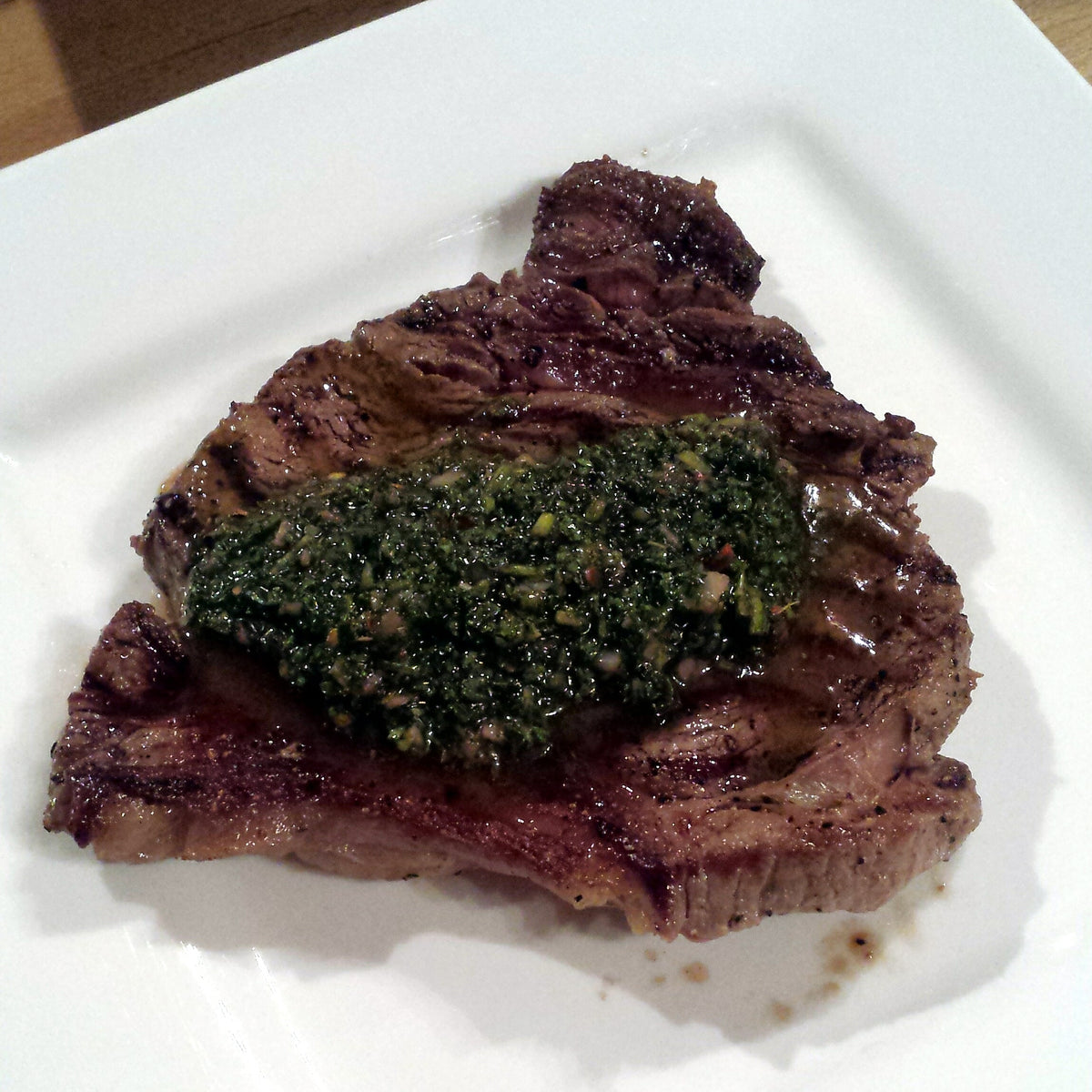 Steak with chimichurri sauce shown as a serving use for Spice Czar Chimichurri Seasoning. Photo by Dominic Lockyer via Wikimedia Commons, CC BY 2.0.