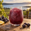 Serving suggestion: Concord Grape Wine Trail slushy with complementary fruit and a lake or moored-boat setting.