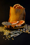 Dried orange, fennel seed, cinnamon and herbs representing the citrus-fennel profile of Spice Czar Greek Sausage Seasoning. Photo by Asli Dokuzeylul via Unsplash, used under the Unsplash License.