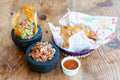 Serving suggestion for Guacamole & Salsa Seasoning: guacamole, fresh salsa and tortilla chips. Food photograph by Snappr/Pexels; not a photograph of the dry blend.