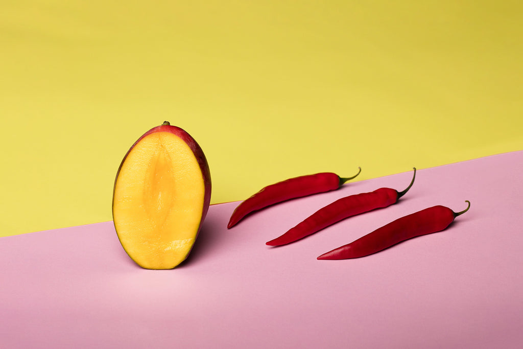 Mango and red chiles representing the fruity sweet-heat profile of Spice Czar Habanero Mango Chicken Rub. Photo by Deon Black via Pexels, free to use under the Pexels license.