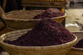 Dried hibiscus flowers showing the deep red dominant ingredient of Spice Czar Hibiscus Ginger Lime Seasoning. Photo by Jamo Photography via Wikimedia Commons, CC0.
