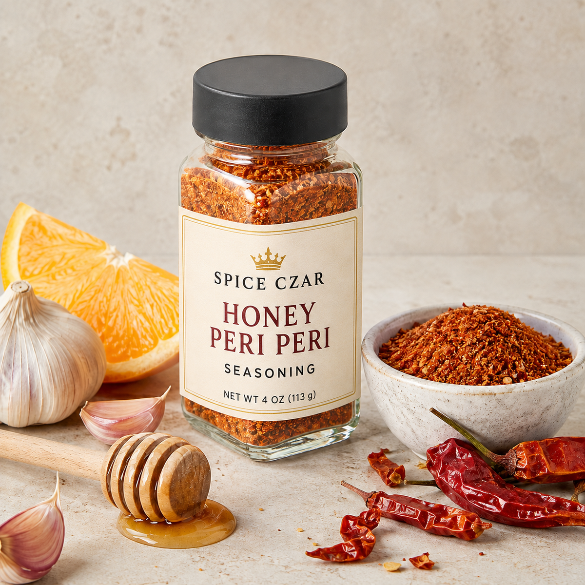 Spice Czar Honey Peri Peri Seasoning in a labeled 4-ounce clear shaker showing the orange-red blend