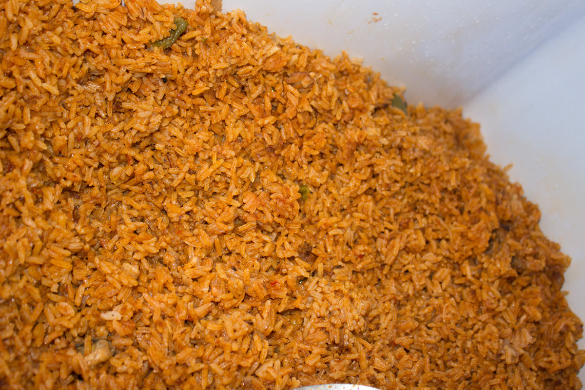 Serving suggestion for Jollof Rice Seasoning: a close-up of cooked tomato-colored jollof rice. Photo by DromoTetteh, CC BY-SA 4.0, via Wikimedia Commons; not a photograph of the dry blend.