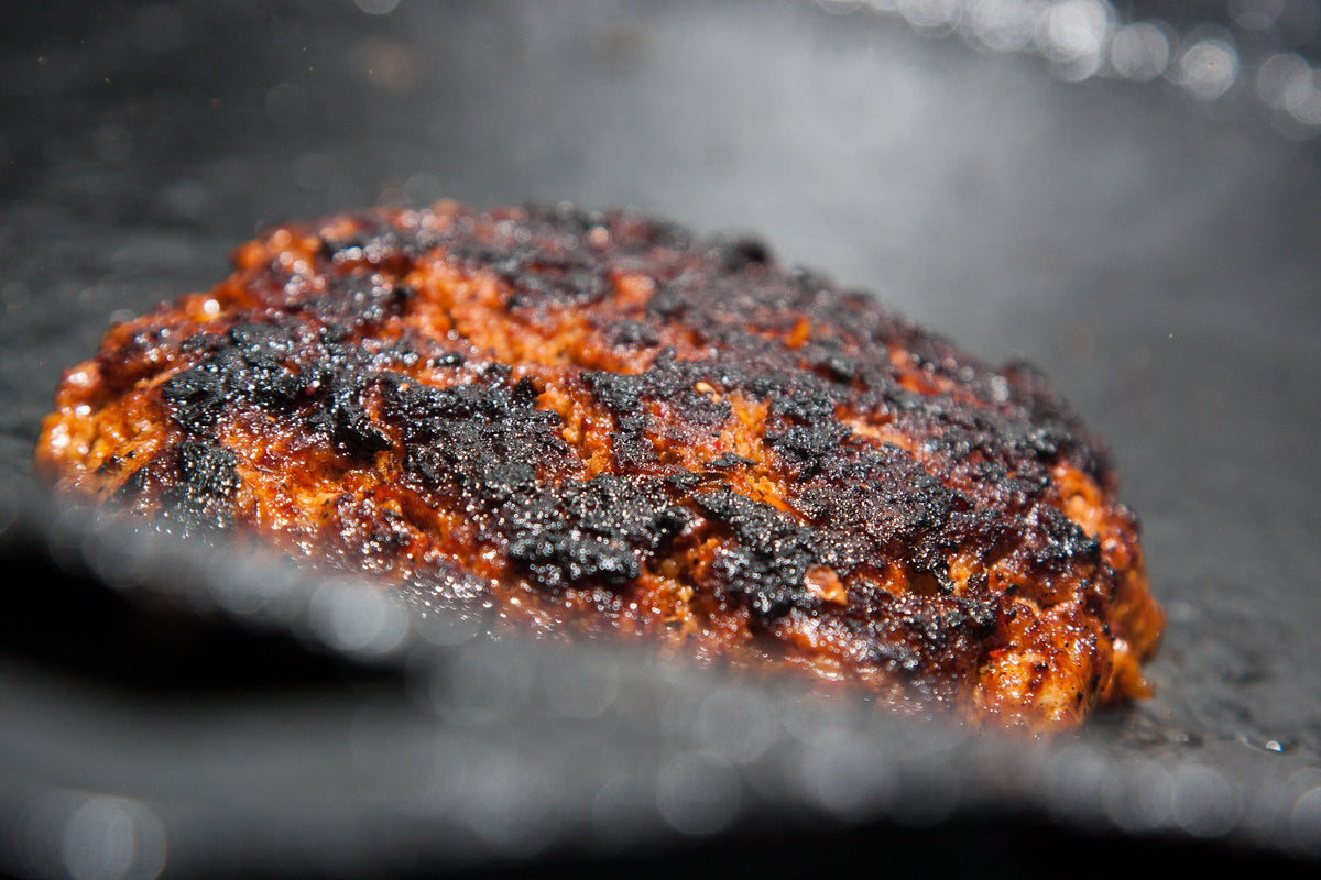 Mexican chorizo cooking on a griddle, a use example for Spice Czar Mexican Chorizo Seasoning. Photo by Ryan Snyder via Wikimedia Commons, CC BY 2.0.