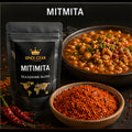 Spice Czar Mitmita with vivid red Ethiopian chile-cardamom spice blend beside a seasoned stew