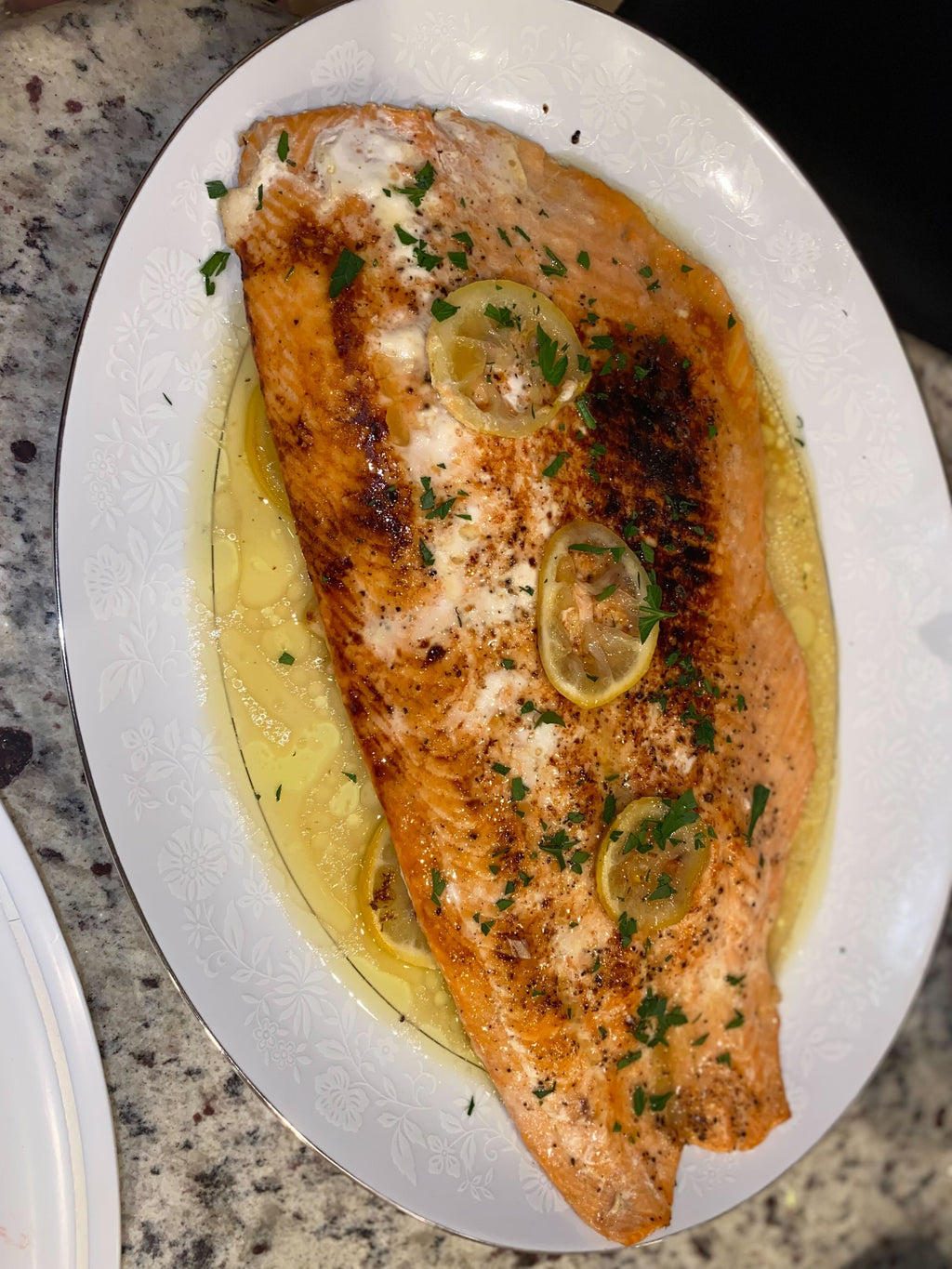 Grilled salmon garnished with lemon, a serving idea for Spice Czar Napa Valley Pepper Seasoning. Photo by Gatorfan252525 via Wikimedia Commons, CC BY-SA 4.0.