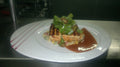 Grilled salmon with greens and lemon butter sauce shown as a serving use for Spice Czar Salmon Seasoning. Photo by Chefranagomes via Wikimedia Commons, CC BY-SA 3.0.