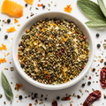 Turkey Brine Seasoning with peppercorns, orange peel, garlic and savory herbs in a bowl