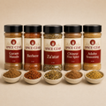 The Spice Czar World Tour bundle with five labeled 2 oz global spice blends and loose spice bowls