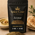Spice Czar Za'atar with green herb, sumac, and sesame texture beside pita and hummus